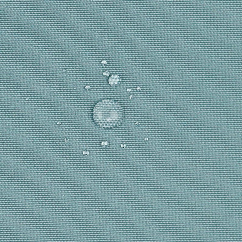 May include: A solid light blue fabric with a tight, woven texture. Several clear water droplets of varying sizes are scattered across the surface, demonstrating a water-repellent quality of the material.