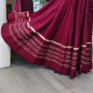 Long skirt lehanga with 7 meter flare with gold lace detailing for dance garba navratri wedding diwali in dark maroon in cotton sateen