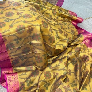Soft silk saree with pochampalli print and kanchi woven zari birdervwuth stitched blouse in yellow and pink contrast great for weddings