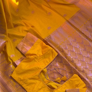 Banaras silk saree in yellow with pink zari weaving designer stitched blouse size 36/38 with tassels on saree end fall and pico done