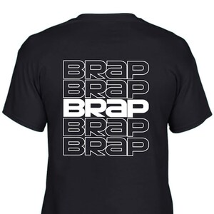 May include: Black t-shirt with the word "BRAP" repeated five times in white, stacked vertically down the back.