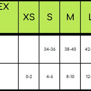 Puede incluir: Tabla de tallas para sudaderas con cremallera frontal unisex Gildan. La tabla muestra las tallas desde XS hasta 3XL con las medidas de pecho correspondientes en pulgadas para hombres y mujeres.