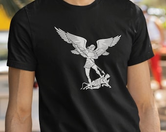May include: Black t-shirt with a white graphic of an angel fighting a demon.
