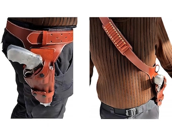 May include: A brown leather holster with a gun attached to a brown leather belt. The holster is worn on the right hip. The gun is a silver revolver. The holster is also worn as a shoulder strap with a brown leather strap.