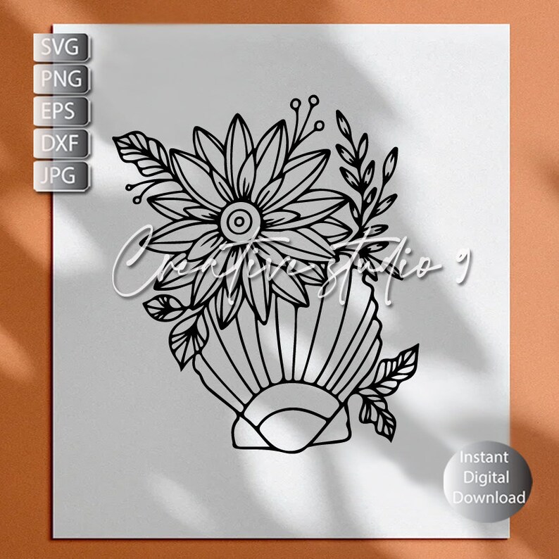 May include: Black and white line art illustration of a seashell with a flower arrangement inside. The flower has multiple petals and a center circle. The seashell has a scalloped edge.