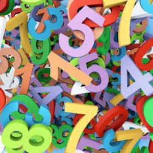 May include: A colorful assortment of numbers in various sizes and colors, including red, yellow, green, blue, and purple. The numbers are scattered, creating a playful and educational visual.