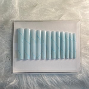 Pastel Blue Glow In The Dark Long Tapered Square Press On Nails With Blue Squiggly Glow In The Dark Design