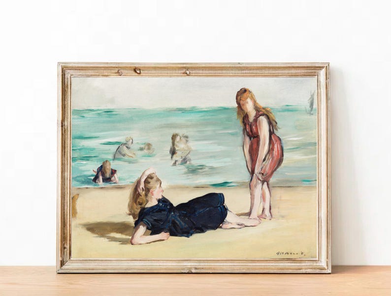 May include: A painting of a beach scene with four people in bathing suits. One person is lying on the sand, while the other three are in the water. The painting is in a light wood frame.