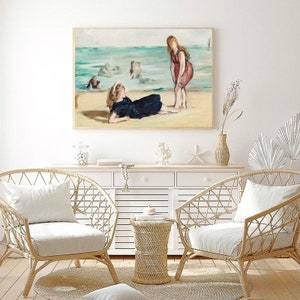 May include: A painting of two women on a beach. One woman is lying down on the sand, while the other is standing and looking at her. The painting is in a light, airy style and features a blue and green color palette.