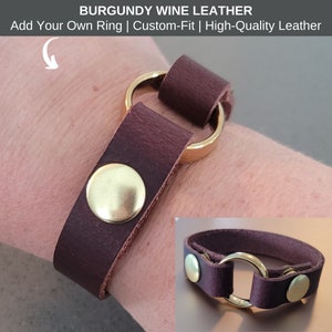 May include: Burgundy leather bracelet with a gold ring and brass accents. Add Your Own Ring | Custom-Fit | High-Quality Leather.
