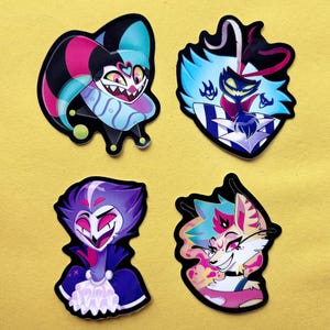 May include: Four colorful stickers featuring cartoon characters with different expressions. The stickers are on a yellow background.