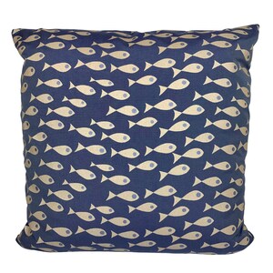 May include: Square cushion featuring a navy blue backdrop adorned with a repeating pattern of beige fish. The fish are arranged in a dynamic design. The cushion is likely made of a soft fabric, suitable for home decor.
