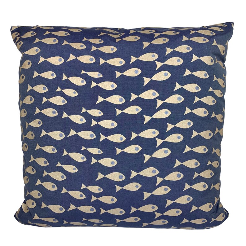May include: Square cushion featuring a navy blue backdrop adorned with a repeating pattern of beige fish. The fish are arranged in a dynamic design. The cushion is likely made of a soft fabric, suitable for home decor.