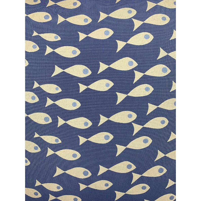 May include: A navy blue fabric featuring a repeating pattern of cream-coloured fish. Each fish has a blue eye and is arranged in a seemingly random, yet organised, layout. The fabric has a textured appearance.