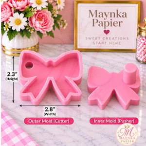 May include: A pink bow-shaped cookie cutter set consisting of an outer mold and an inner mold pusher. The cutter measures 2.3 inches in height and 2.8 inches in width. The set is labeled as Outer Mold (Cutter) and Inner Mold (Pusher) in text.
