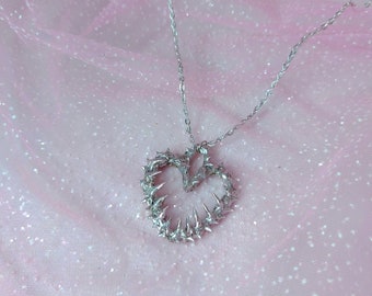 Spikey metal heart charm necklace