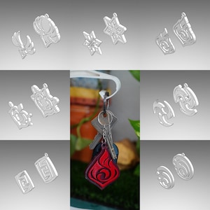 Könnte beinhalten: Ein Set mit 10 verschiedenen Schlüsselanhängern mit verschiedenen Designs, darunter eine Schneeflocke, ein Hirsch, ein Herz und eine Flamme. Die Schlüsselanhänger sind aus Metall und silberfarben. Ein Schlüsselanhänger ist rot.