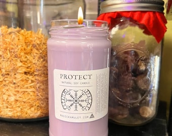May include: Purple soy candle with a white label that reads "PROTECT NATURAL SOY CANDLE" and a black symbol. The label also includes the website "MAGIC KAMULET.COM".