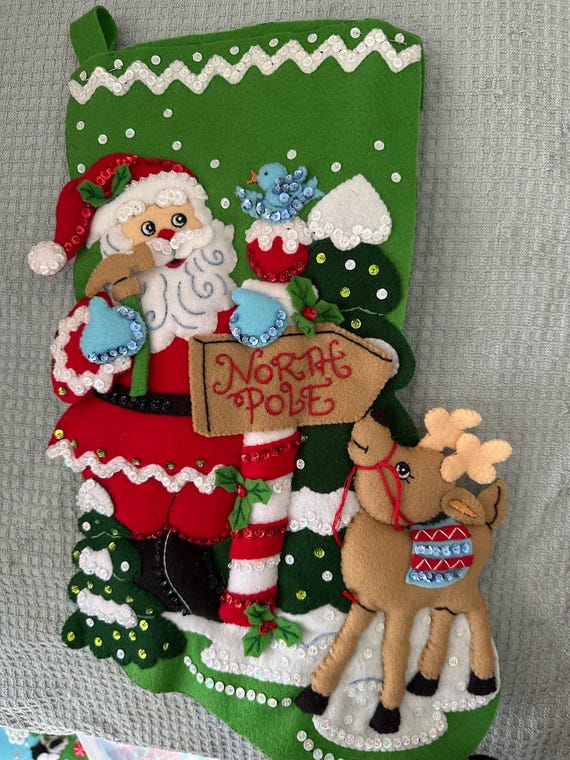 This is an 18" Bucilla "North Pole This Way" Christmas stocking