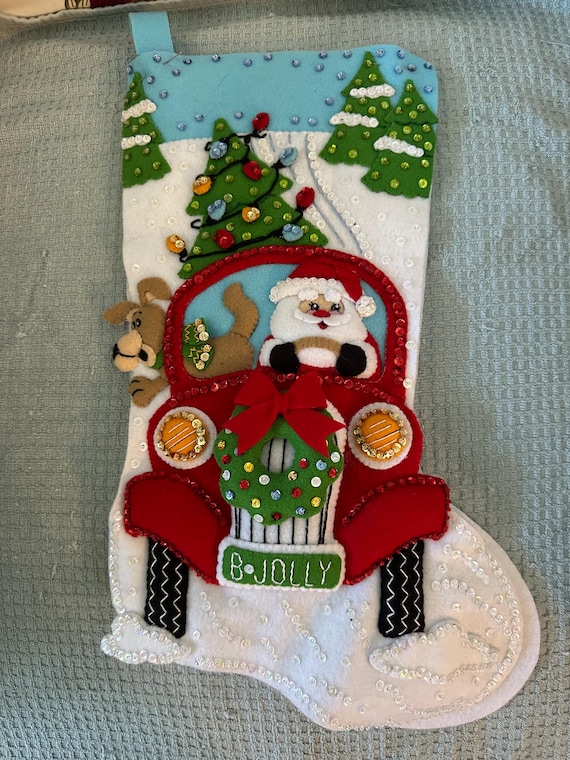 This is an 18" Bucilla "Jolly deliveries" Christmas Stocking