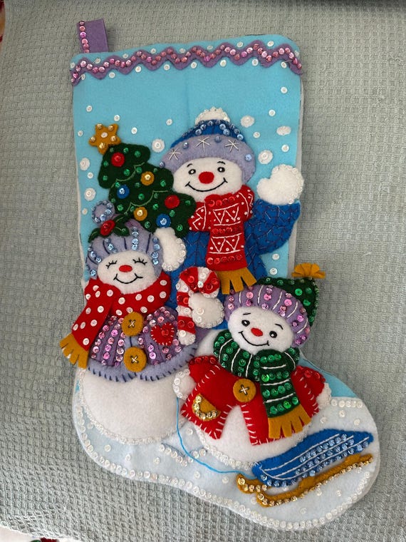 This is an 18" Bucilla "Snow Family Portrait" Christmas Stocking