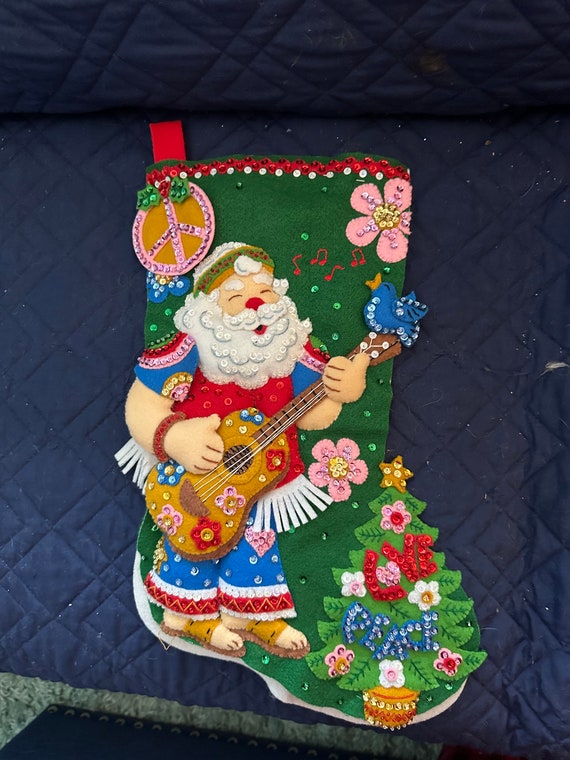 This is finished Bucilla "Peace and Love" stocking