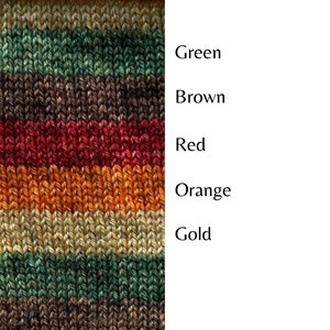 May include: Striped knitted fabric in shades of gold, orange, red, brown, and green.