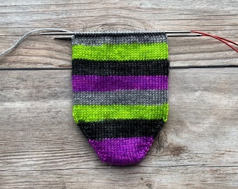 Dyed To Order: Bump In The Night | Self-striping Sock Yarn | Fluorescent Green, Black, Fluorescent Purple, Dark Gray | Blacklight