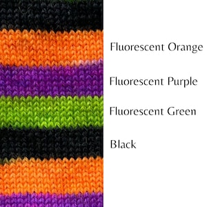 May include: Striped knitted fabric in black, fluorescent orange, fluorescent purple, and fluorescent green.
