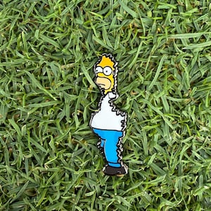May include: A yellow cartoon character with blue pants and a white shirt. The character is standing on a green grassy surface.