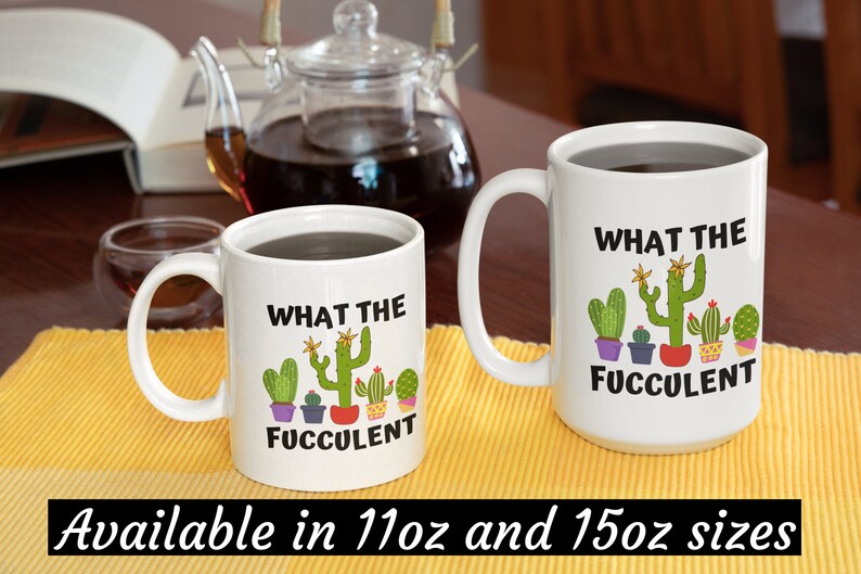 May include: Two white ceramic mugs with black text and colorful cactus illustrations. The text on the mugs reads "What the Fuccolent". The mugs are available in 11oz and 15oz sizes.