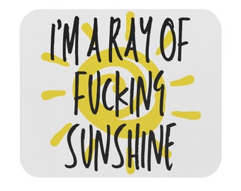 May include: A white mousepad with a yellow sun and black text that reads "I'm a ray of fucking sunshine".