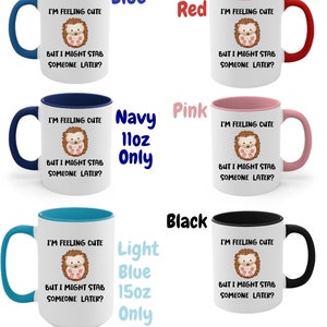 May include: Set of 11oz and 15oz ceramic mugs with a white background and a colored rim. The mugs feature a cartoon hedgehog with the text "I'm feeling cute but I might stab someone later?" The mugs are available in blue, red, navy, pink, light blue, and black.