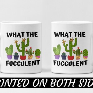 May include: White ceramic coffee mug with a black and green graphic of a row of potted succulents with the text "What the Fuc-culent" printed on both sides.