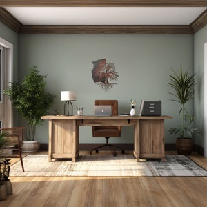 May include: A home office with a wooden desk, a brown leather office chair, a lamp, and a metal tree wall art. The room has a light green wall and a rug on the floor.