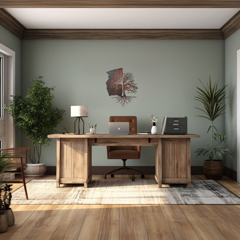 May include: A home office with a wooden desk, a brown leather office chair, a lamp, and a metal tree wall art. The room has a light green wall and a rug on the floor.