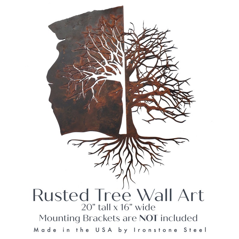 May include: Rusted metal tree wall art with a split trunk and intricate branches. The tree is 20 inches tall and 16 inches wide.  "Rusted Tree Wall Art" and "Mounting Brackets are NOT included" are printed below the tree. "Made in the USA by Ironstone Steel" is printed below the text.