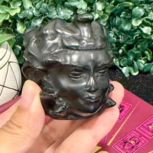 Obsidian Medusa crystal carving,greek methodology medusa,snake hair medusa crystal,polished obsidian carving,protection crystal carving