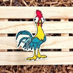 May include: Embroidered patch of a cartoon rooster with large eyes, a red comb, yellow body, and blue tail feathers.