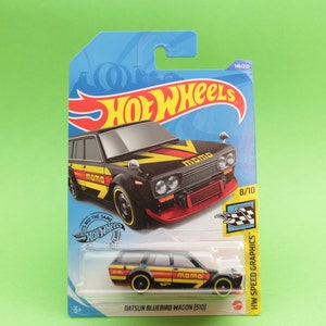 May include: A black and yellow Hot Wheels Datsun Bluebird Wagon with "MOMO" printed on the side. The car is on a blue background with the Hot Wheels logo and "HW Speed Graphics" text.