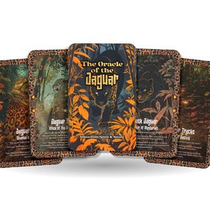 May include: A deck of oracle cards titled "The Oracle of the Jaguar." The cards feature illustrations of jaguars, foliage, and text. The central card displays a black jaguar with orange leaves and the title.