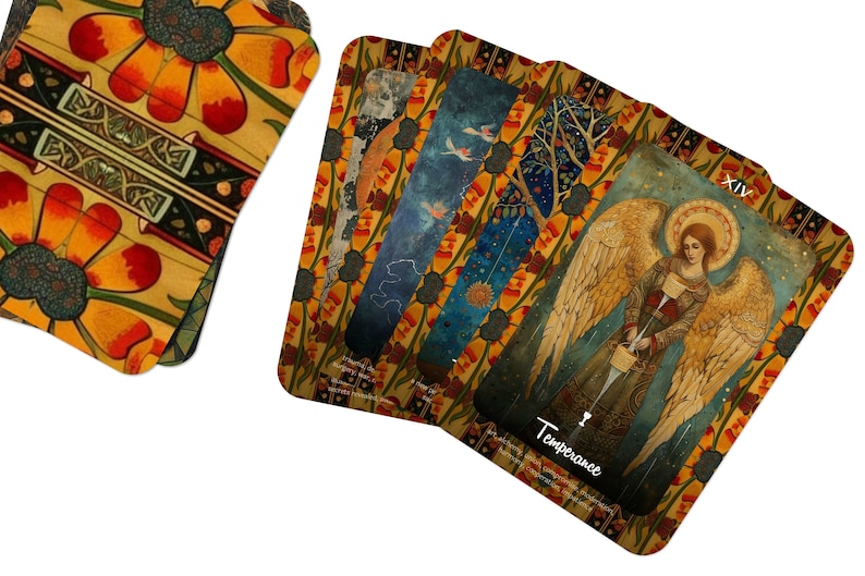 May include: A deck of tarot cards with a floral design on the back. The cards feature illustrations of angels, celestial bodies, and nature scenes. One card is labeled "Temperance". The color palette includes gold, orange, and blue.