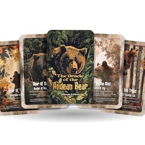 May include: A set of oracle cards with bear illustrations. The central card is titled "The Oracle of the Andean Bear" with the subtitle "Animals & Birds." Other cards depict bears in forest and natural environments.