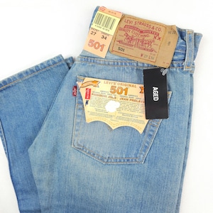 Levi's 501 Vintage Deadstock with Tags W26 L34 Actual Size Measured W26-65cm L33-83cm. Perfect Condition! Levi' 501 light blue wash 80s