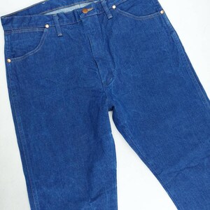 May include: A pair of blue denim jeans with a classic five-pocket style. The jeans have a straight leg and a relaxed fit.