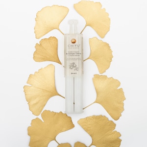 May include: A clear, two-part glue tube with the text "CHIYU" and "Bio-based glue" is centered on a white background. The glue tube is surrounded by golden-colored ginkgo leaves. The tube contains 24 ml of glue.