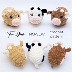 May include: Three plush crochet cow toys in tan, white with black spots, and brown, each with a pink snout and black eyes. The image includes the text For Didi NO-SEW crochet pattern, showing both front and back views of the stuffed animal figures.