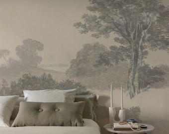 Può includere: Una camera da letto con un letto bianco, una coperta blu e un comodino con un libro, candele e una collana di perle. La parete dietro il letto è dipinta con un paesaggio ad acquerello di alberi e colline.