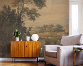 May include: A watercolor landscape mural featuring a large tree in the foreground and a distant view of rolling hills. The mural is displayed on a wall in a living room setting with a white armchair and a wooden cabinet.