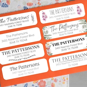 May include: A sheet of address labels with the name "The Pattersons" and address details. The labels are white with rounded corners, set against an orange background. Floral and botanical designs decorate some labels.